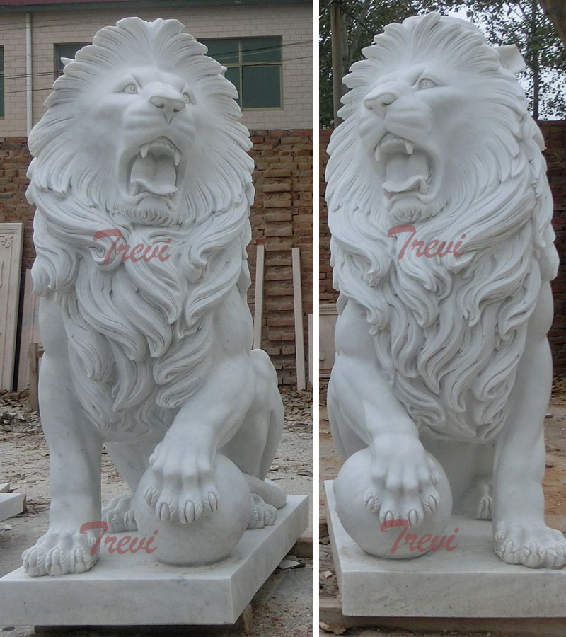 White marble sitting lion statues with paw on ball for front porch