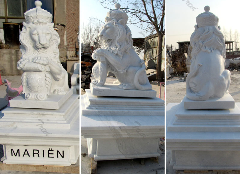 Pair of life size white marble king lion statue with shield and crown in front of house.jpg
