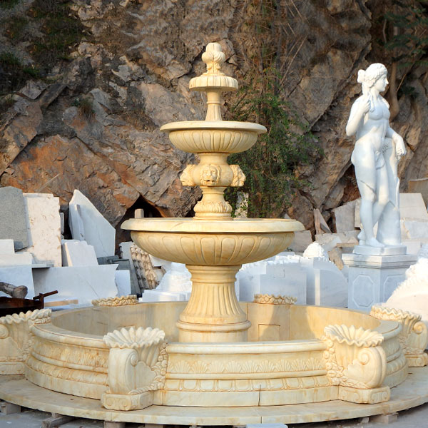Outdoor classical three tiered water fountains in the center of the garden