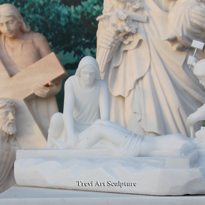 jesus is nailed to the cross marble statue detail