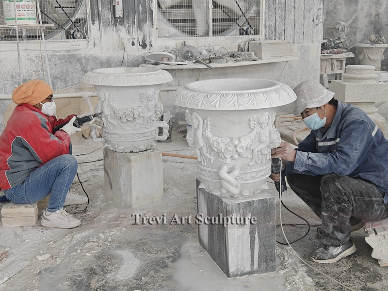 large white marble planter carving process