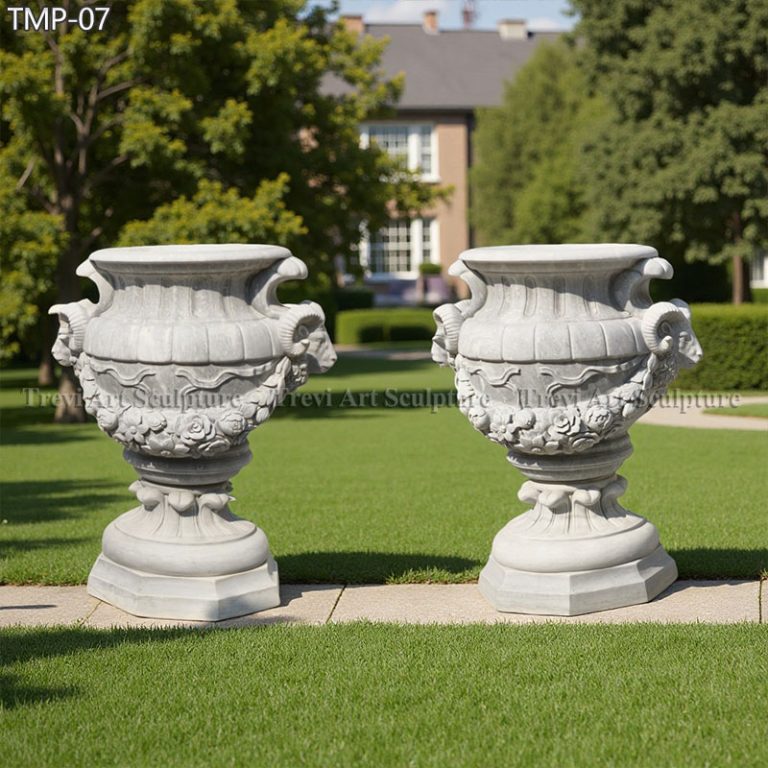 large white marble planter with goat relief