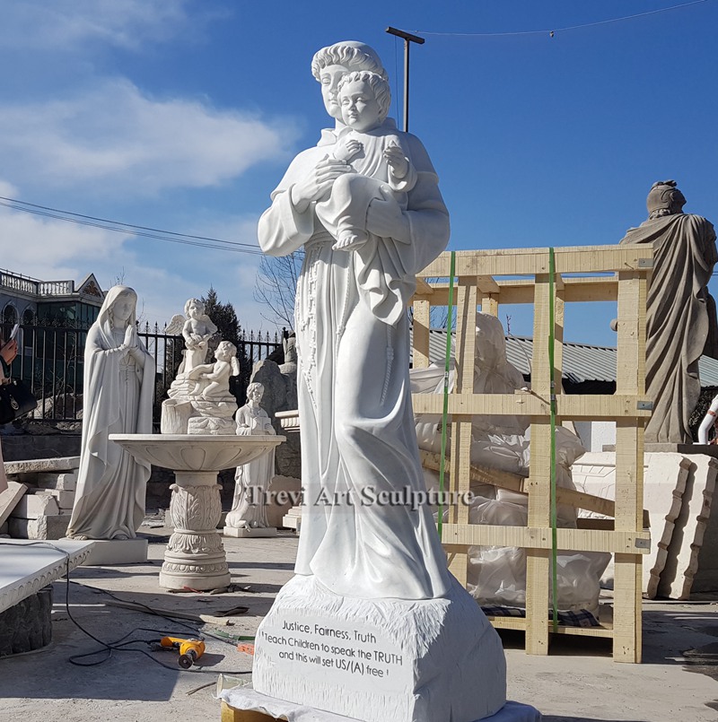 outdoor marble statue of st anthony with baby jesus