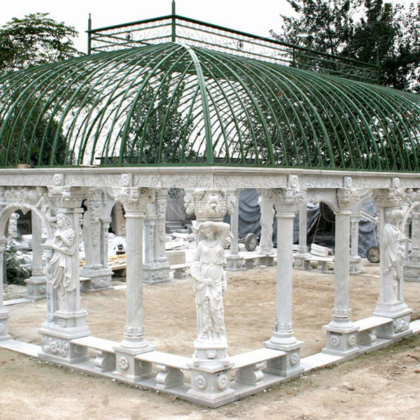 Outdoor luxury white marble pavilion with wrought iron dome sit at the center of the hotel