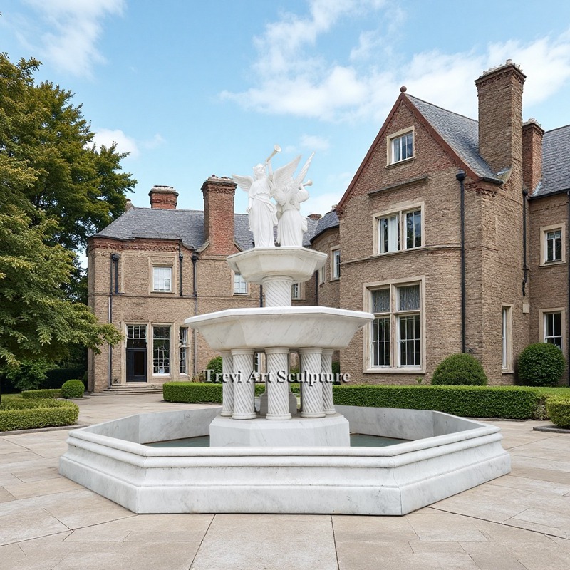 tiered water fountain with angel blowing a trumpet