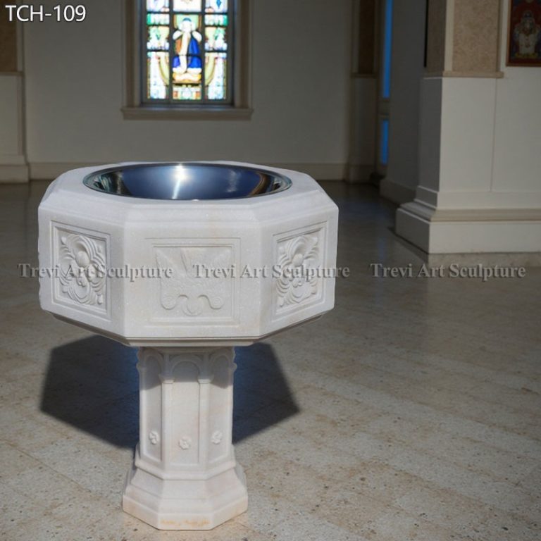 decorative marble baptismal font in catholic church