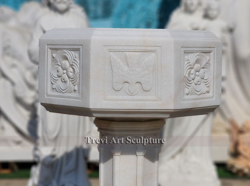 white marble baptismal font