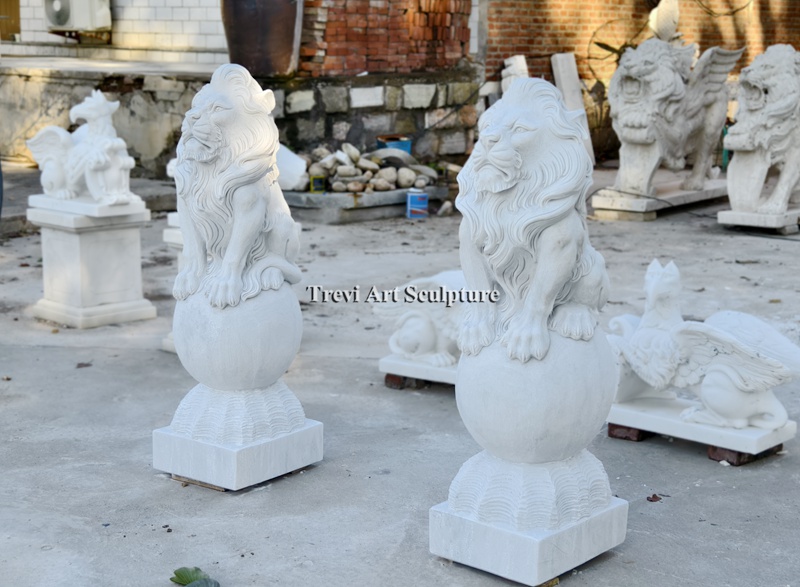 pair of marble lions statue on ball