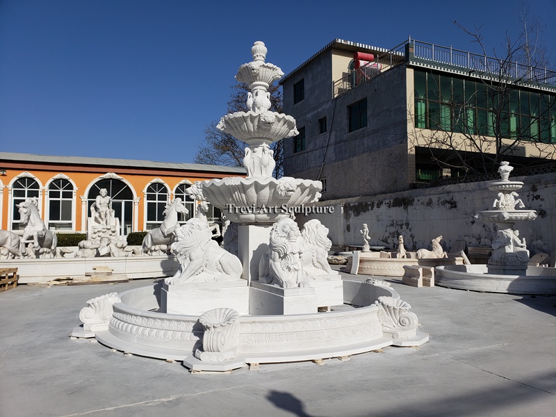 marble garden fountain with sitting lion statues