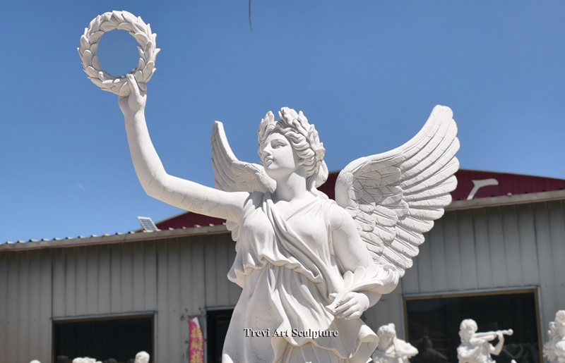 angel statue holding wreath details