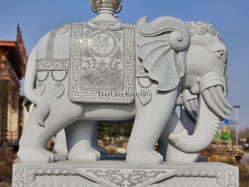 stone elephant statue with trunk down details