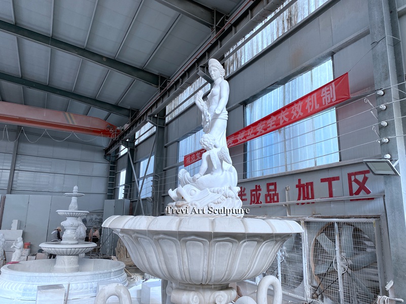 large marble female statue water fountain with swan