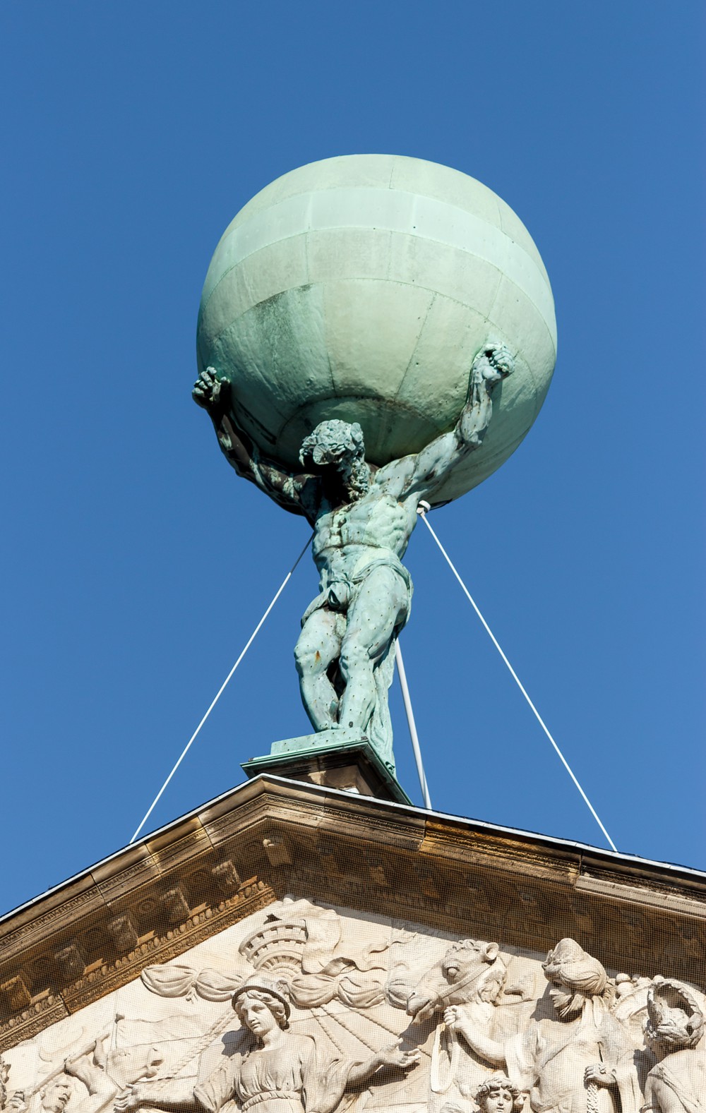 statue of atlas by artus quellinus i, royal palace of amsterdam, the netherlands.