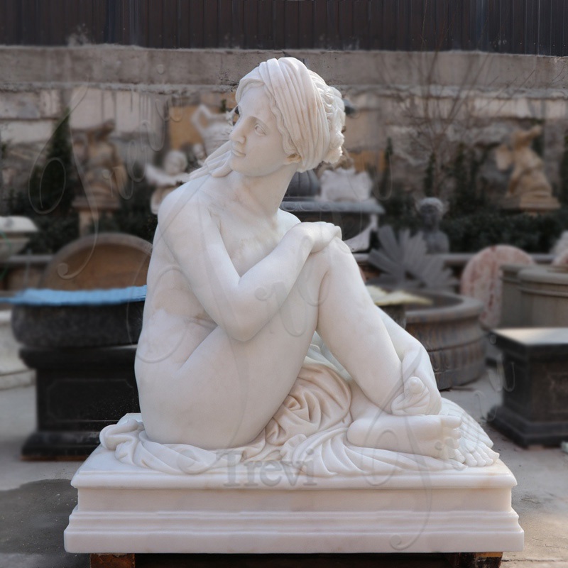 sitting nude woman statue