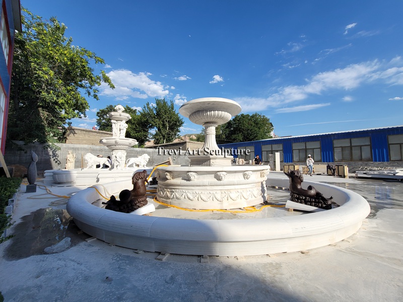 fountain with bronze fish statues