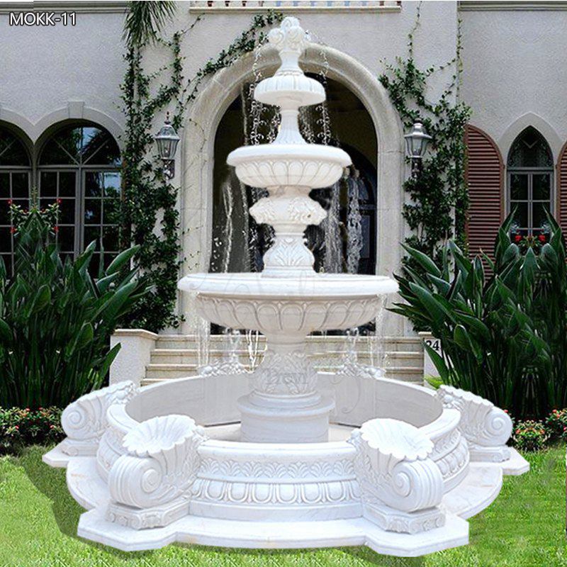 Outdoor-classical-three-tiered-marble-water-fountains-in-the-center-of-the-garden