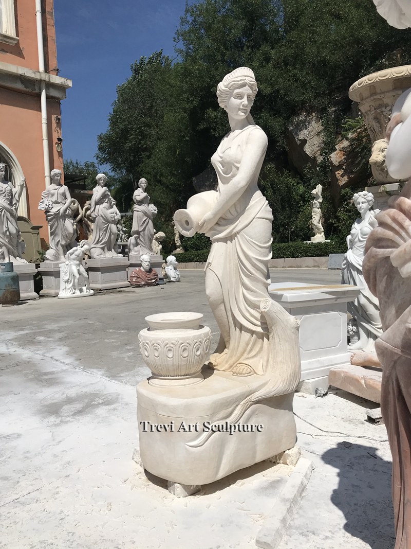 outdoor female figure statue fountain with pouring jug