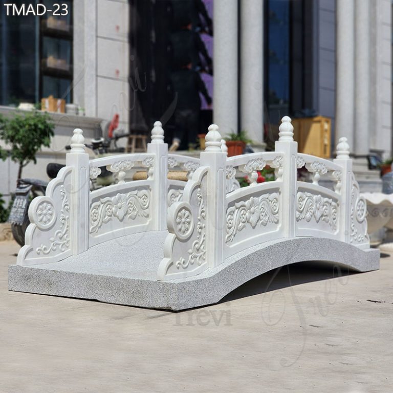 Our marble arches outdoor garden bridges boast timeless elegance, characterized by their classic design and impeccable craftsmanship. Each bridge is meticulously hand-carved from pure white, high-quality marble, ensuring both durability and aesthetic appeal. Renowned for their exquisite beauty, these bridges have become a signature choice among Manor Estate clients seeking to elevate their outdoor spaces with sophistication and charm. Outdoor Garden Bridge Show What sets our marble garden bridges apart is not only their diverse range of styles but also our commitment to customization. Whether you desire a classic design or a more contemporary aesthetic, our skilled artisans can tailor-make a bridge to suit your unique preferences and specifications. Attention to detail is at the heart of our craft. Every curve, every flourish, is meticulously carved to perfection, ensuring that each bridge is a true work of art. From ornate balustrades to delicate floral motifs, our bridges are adorned with exquisite details that captivate the eye and inspire admiration. High-Quality Marble Materials for Outdoor Our marble outdoor garden bridges are crafted from premium natural marble, meticulously handpicked by our director Dora herself. The superior quality of the marble ensures the creation of exquisite outdoor bridges. Made from top-grade white marble, these pieces are durable for outdoor use and promise longevity. They are sure to enhance the beauty of any outdoor setting, be it a garden, country yard, or estate. Creating a Retro Elegant Ambiance Marble bridges are revered for their ability to infuse outdoor settings with an air of nobility, elegance, and vintage charm. Their timeless appeal stems from several key attributes that contribute to their regal and sophisticated presence in outdoor landscapes. Marble itself is a symbol of luxury and opulence. Known for its natural beauty, durability, and unique veining patterns, marble has been prized for centuries in architectural and artistic contexts. When used to create garden bridges in outdoor spaces, marble instantly elevates the ambiance, exuding a sense of refinement and grandeur. Why Choose Trevi Factory TREVI is responsible for every customer. So, if you are interested in this marble tables with benches set, or you have other needs, you can contact us at any time.