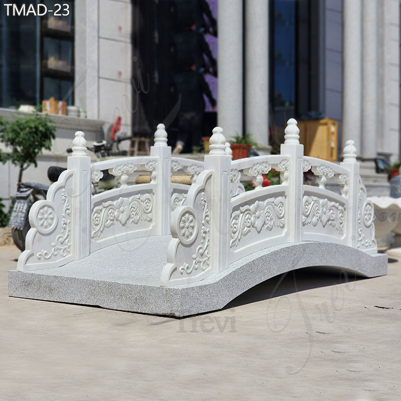Our marble arches outdoor garden bridges boast timeless elegance, characterized by their classic design and impeccable craftsmanship. Each bridge is meticulously hand-carved from pure white, high-quality marble, ensuring both durability and aesthetic appeal. Renowned for their exquisite beauty, these bridges have become a signature choice among Manor Estate clients seeking to elevate their outdoor spaces with sophistication and charm. Outdoor Garden Bridge Show What sets our marble garden bridges apart is not only their diverse range of styles but also our commitment to customization. Whether you desire a classic design or a more contemporary aesthetic, our skilled artisans can tailor-make a bridge to suit your unique preferences and specifications. Attention to detail is at the heart of our craft. Every curve, every flourish, is meticulously carved to perfection, ensuring that each bridge is a true work of art. From ornate balustrades to delicate floral motifs, our bridges are adorned with exquisite details that captivate the eye and inspire admiration. High-Quality Marble Materials for Outdoor Our marble outdoor garden bridges are crafted from premium natural marble, meticulously handpicked by our director Dora herself. The superior quality of the marble ensures the creation of exquisite outdoor bridges. Made from top-grade white marble, these pieces are durable for outdoor use and promise longevity. They are sure to enhance the beauty of any outdoor setting, be it a garden, country yard, or estate. Creating a Retro Elegant Ambiance Marble bridges are revered for their ability to infuse outdoor settings with an air of nobility, elegance, and vintage charm. Their timeless appeal stems from several key attributes that contribute to their regal and sophisticated presence in outdoor landscapes. Marble itself is a symbol of luxury and opulence. Known for its natural beauty, durability, and unique veining patterns, marble has been prized for centuries in architectural and artistic contexts. When used to create garden bridges in outdoor spaces, marble instantly elevates the ambiance, exuding a sense of refinement and grandeur. Why Choose Trevi Factory TREVI is responsible for every customer. So, if you are interested in this marble tables with benches set, or you have other needs, you can contact us at any time.