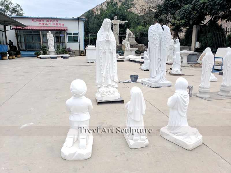 white marble our lady of fatima statue with three children