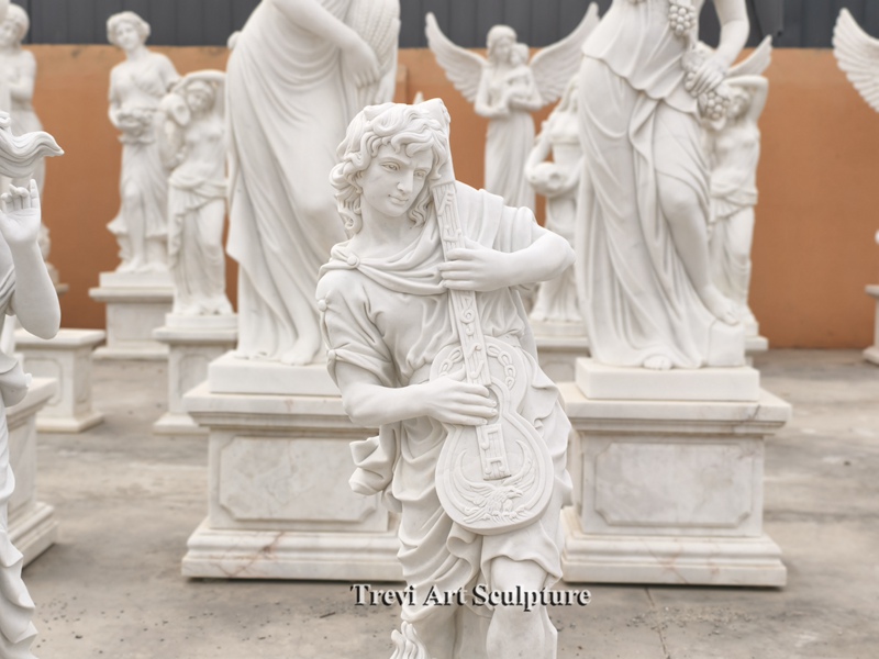 four seasons sculpture playing instruments