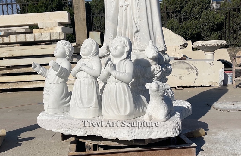 marble virgin fatima with children and lamb statue