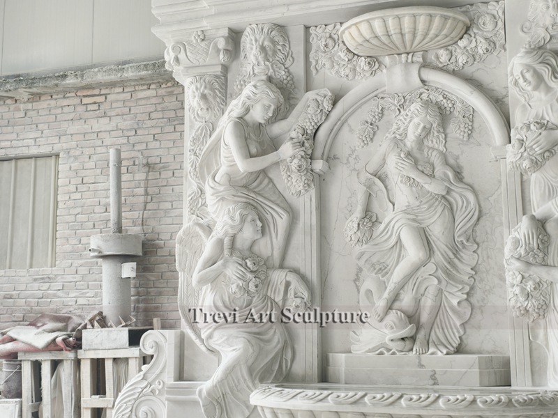 stone carved large wall fountain with relief details