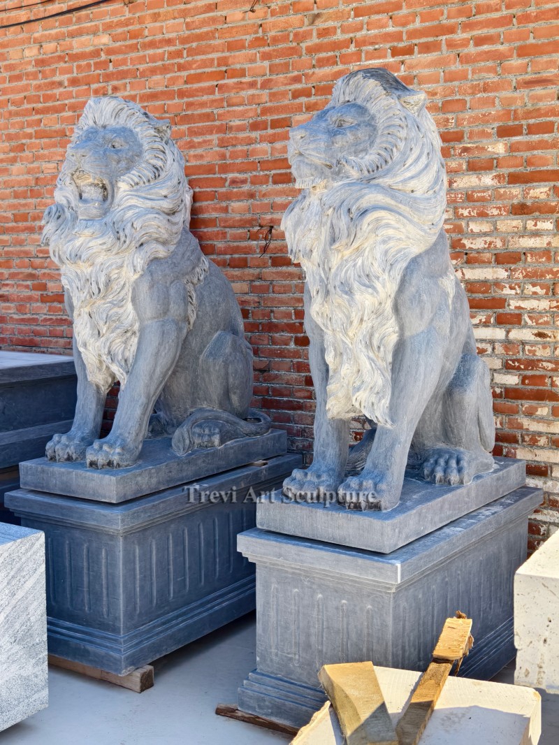 grey stone lion statue