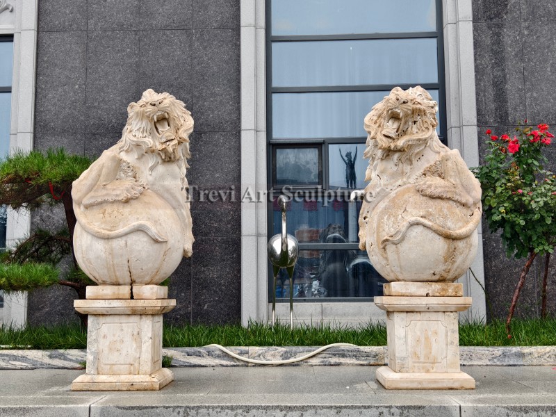 lion statue standing on ball