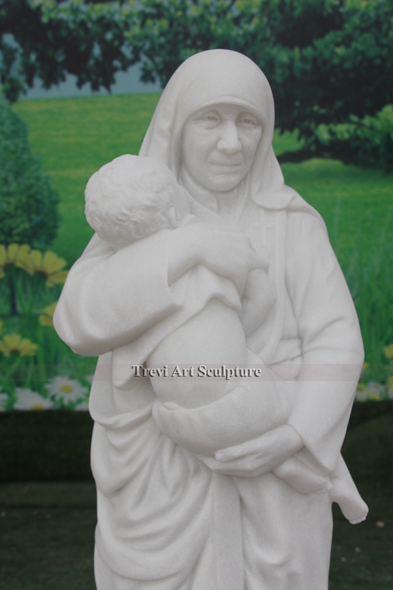 garden st teresa of calcutta with children statue