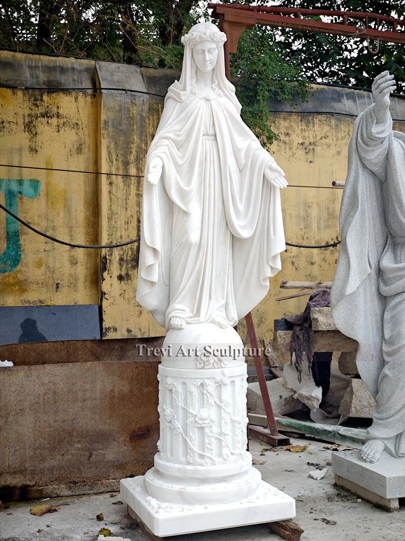 marble virgin mary statue with wreath