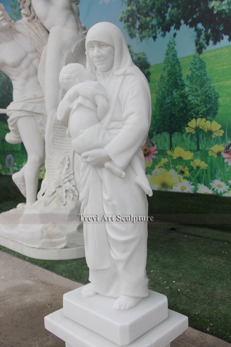 white marble st teresa of calcutta with children statue