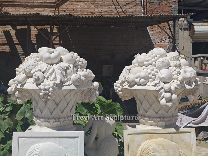 elegant white marble flower pot with carved fruits