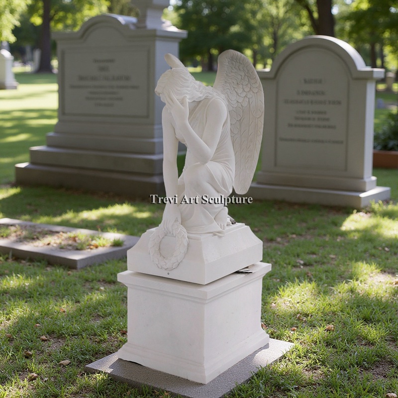 carved marble sad kneeling angel statue