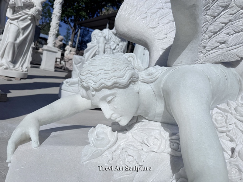 mourning angel lying down statue details