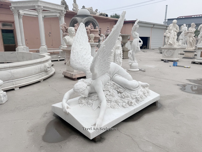 mourning angel lying down statue