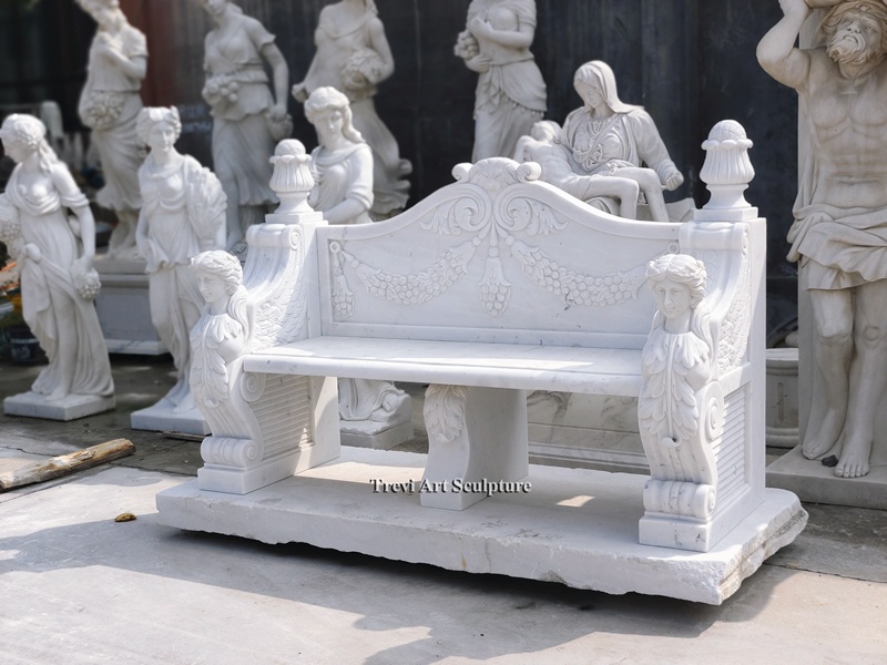 white garden bench carved caryatids