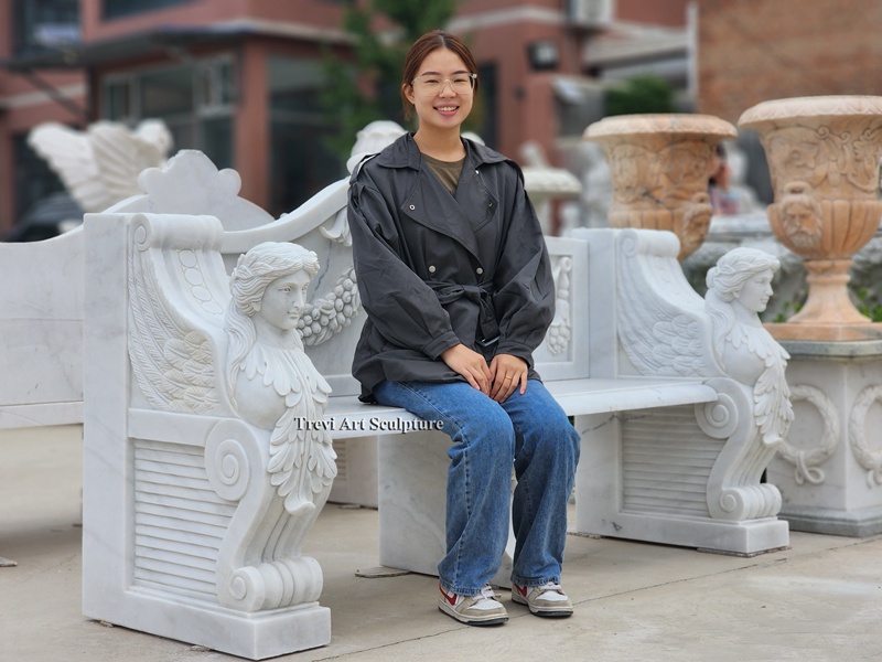 white garden bench with hand carved caryatids trevi
