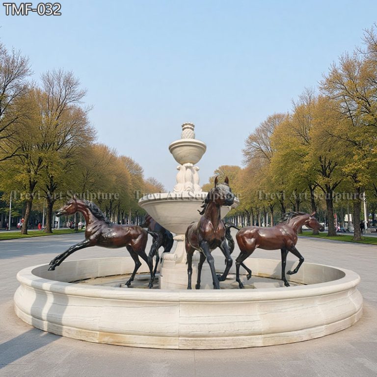 large bronze horse fountain with marble pool surround
