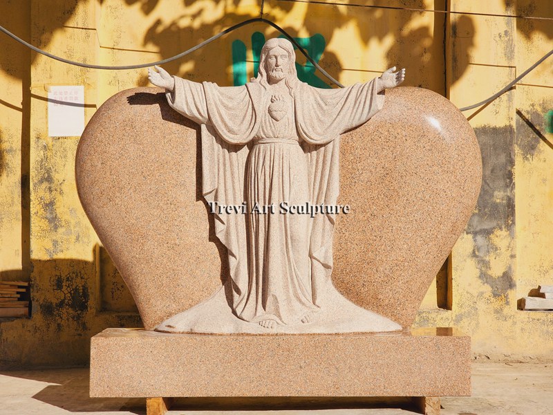 red granite jesus statue heart shaped headstone