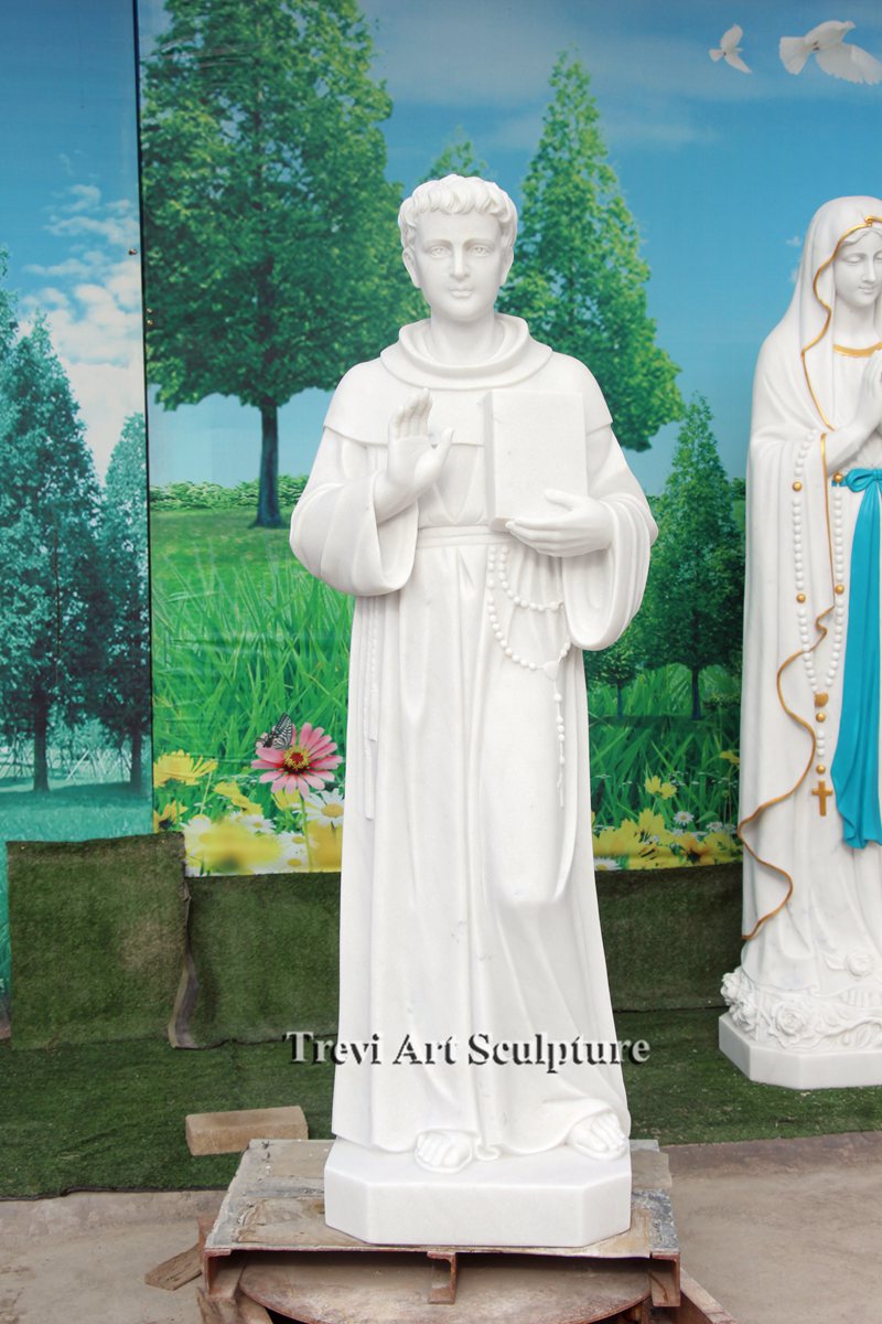 white marble saint thomas aquinas church statue