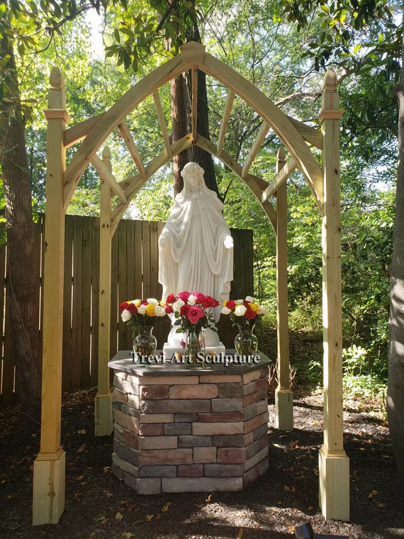 arched frame around virgin mary statue
