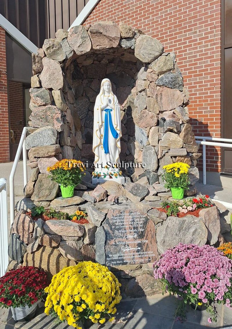 install the virgin mary statue in an outdoor stone niche