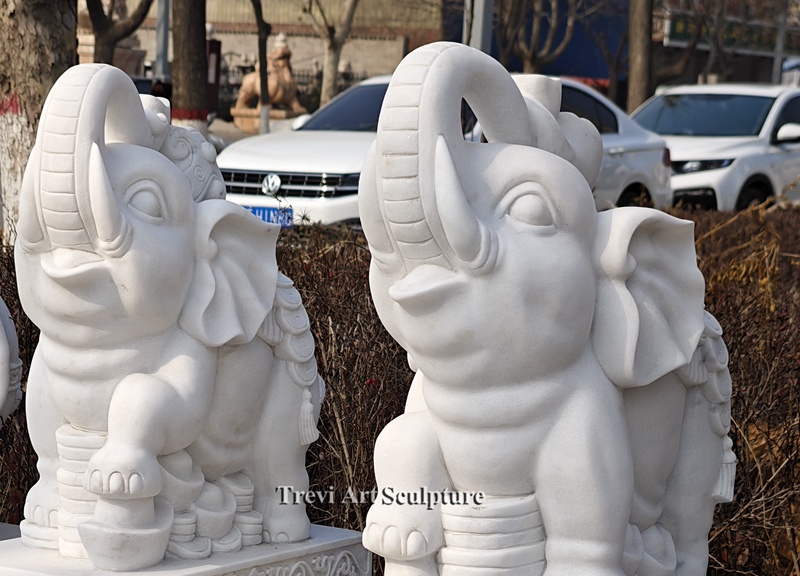 white elephant statue with trunk up details