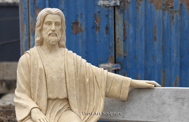 jesus sitting on a bench sculpture
