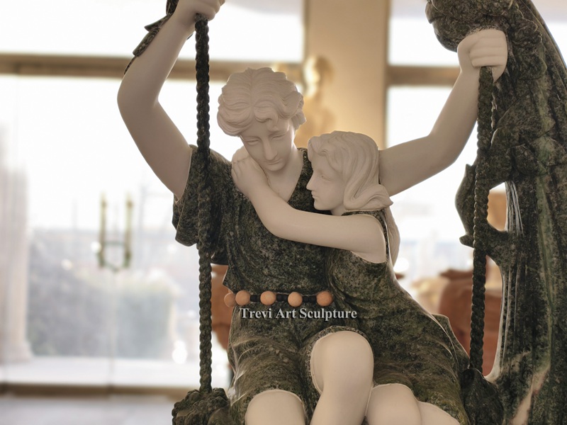 romantic couple on swing statue details