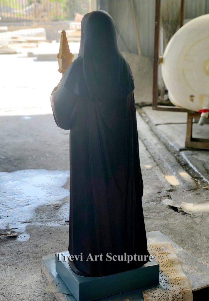 back side of saint clare of assisi statue