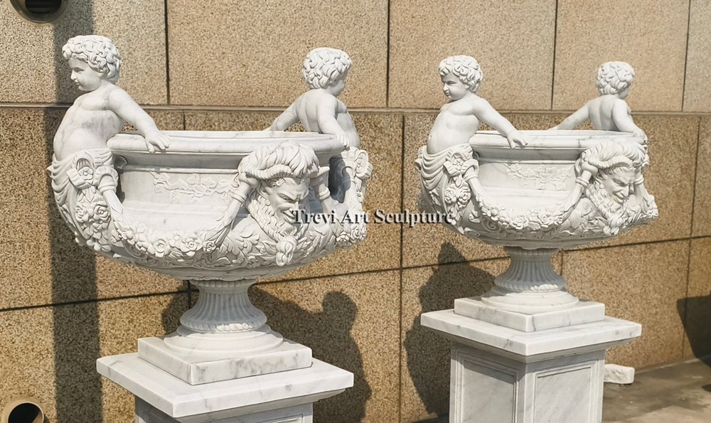 garden planter with cherub details