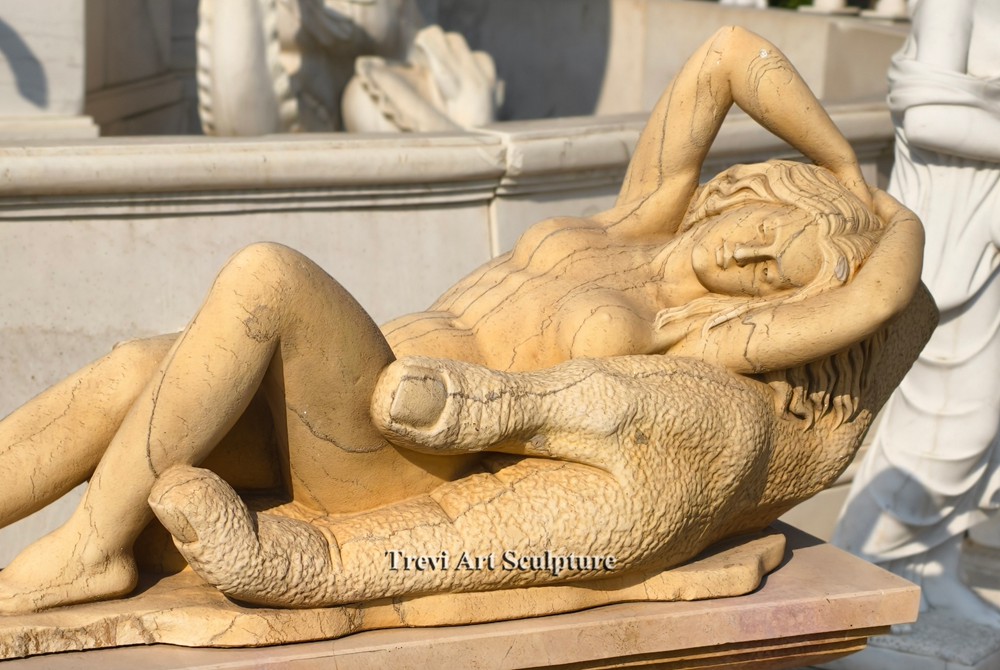 reclining woman resting in a big hand statue details