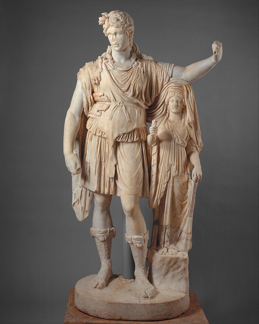 statue of dionysos leaning on a female figure